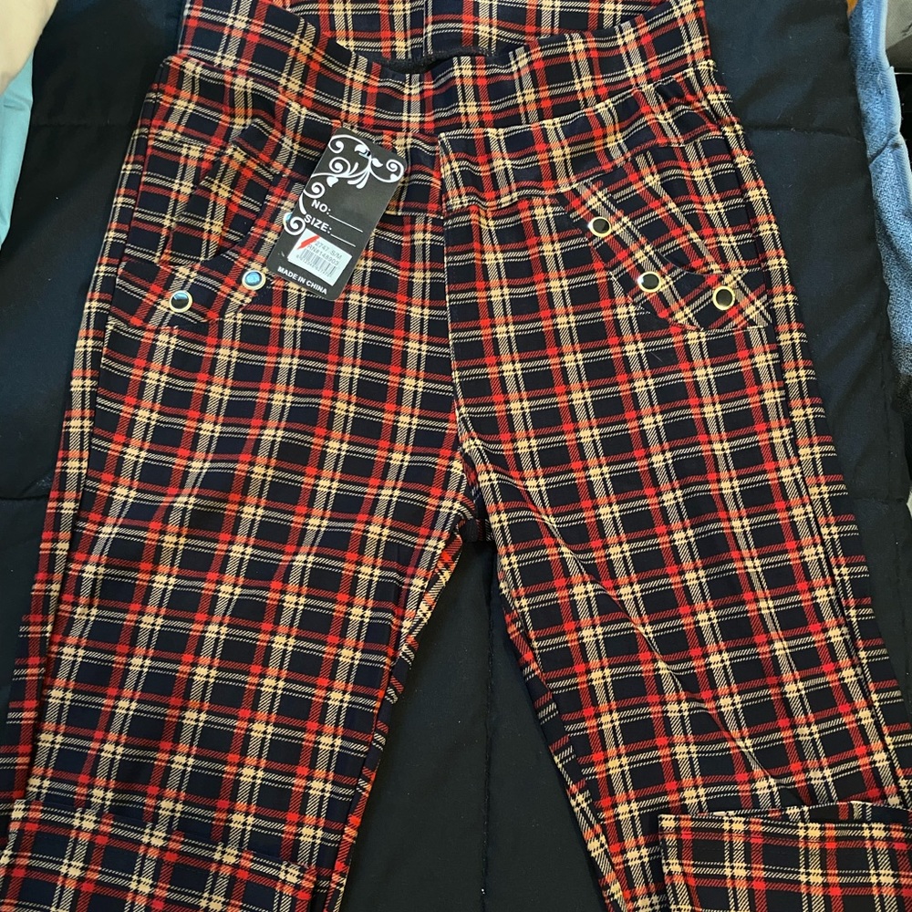Red, tan, and black striped Capris pants